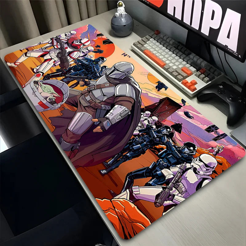Desk setup with a large mouse pad featuring superhero designs.