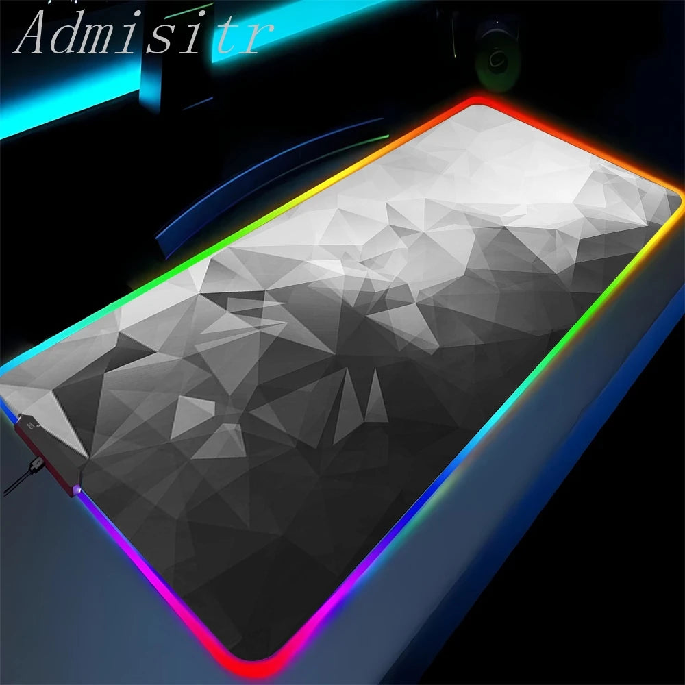 Gaming mouse pad with geometric design and colorful LED edges on a dark background.