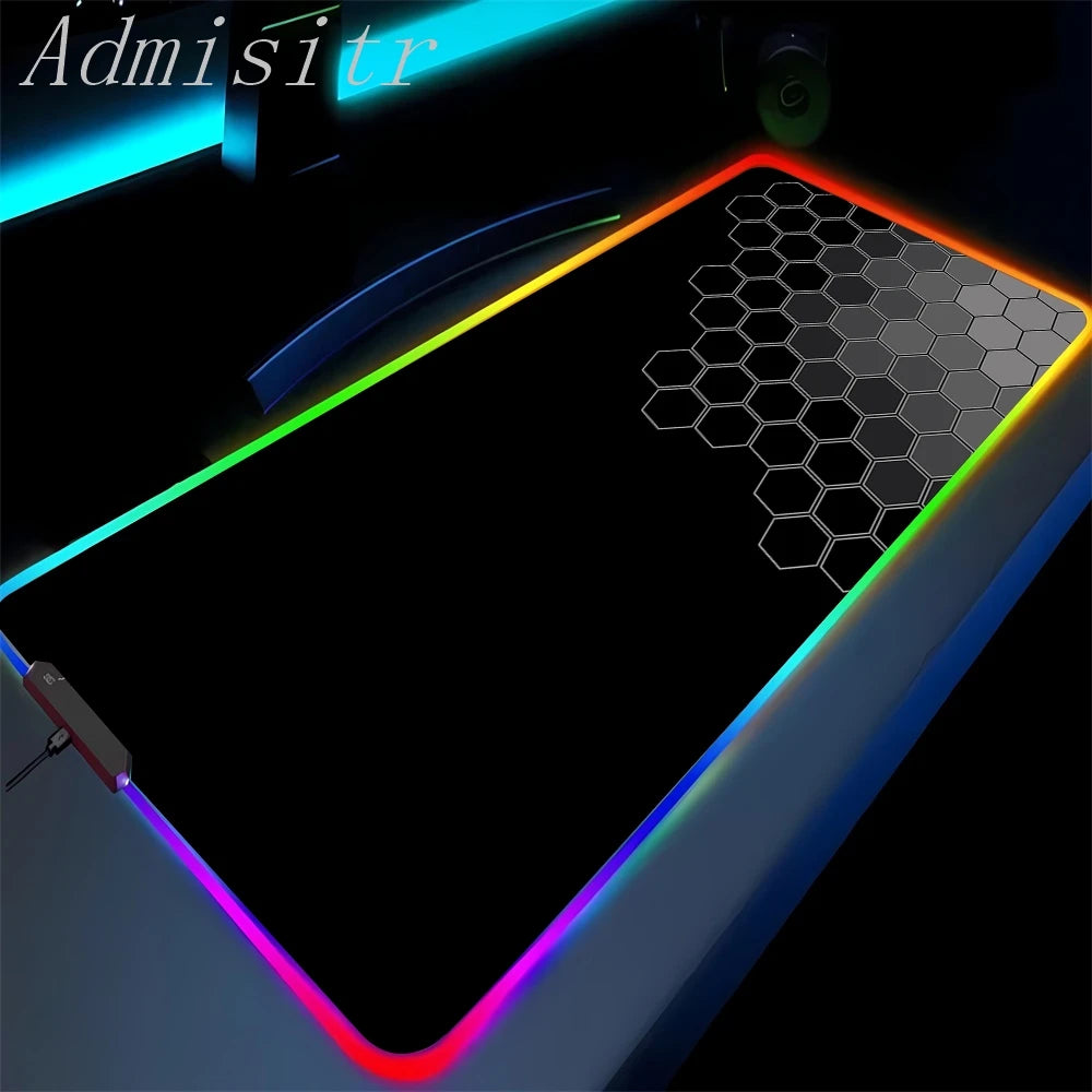 Gaming mouse pad with RGB lighting and honeycomb design on a dark background