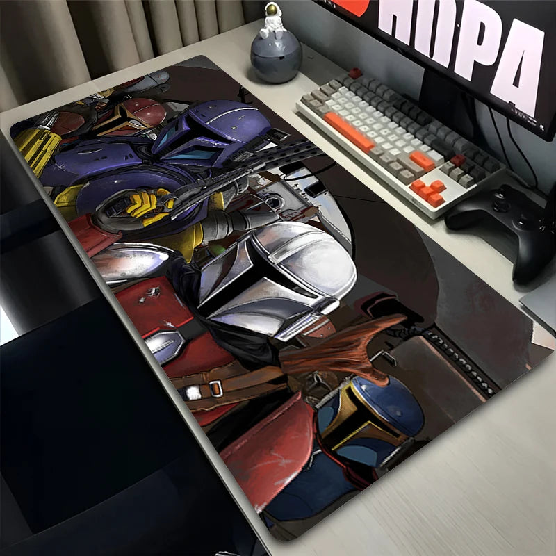Desk setup with a colorful mouse pad featuring various shoes, keyboard, and monitor.