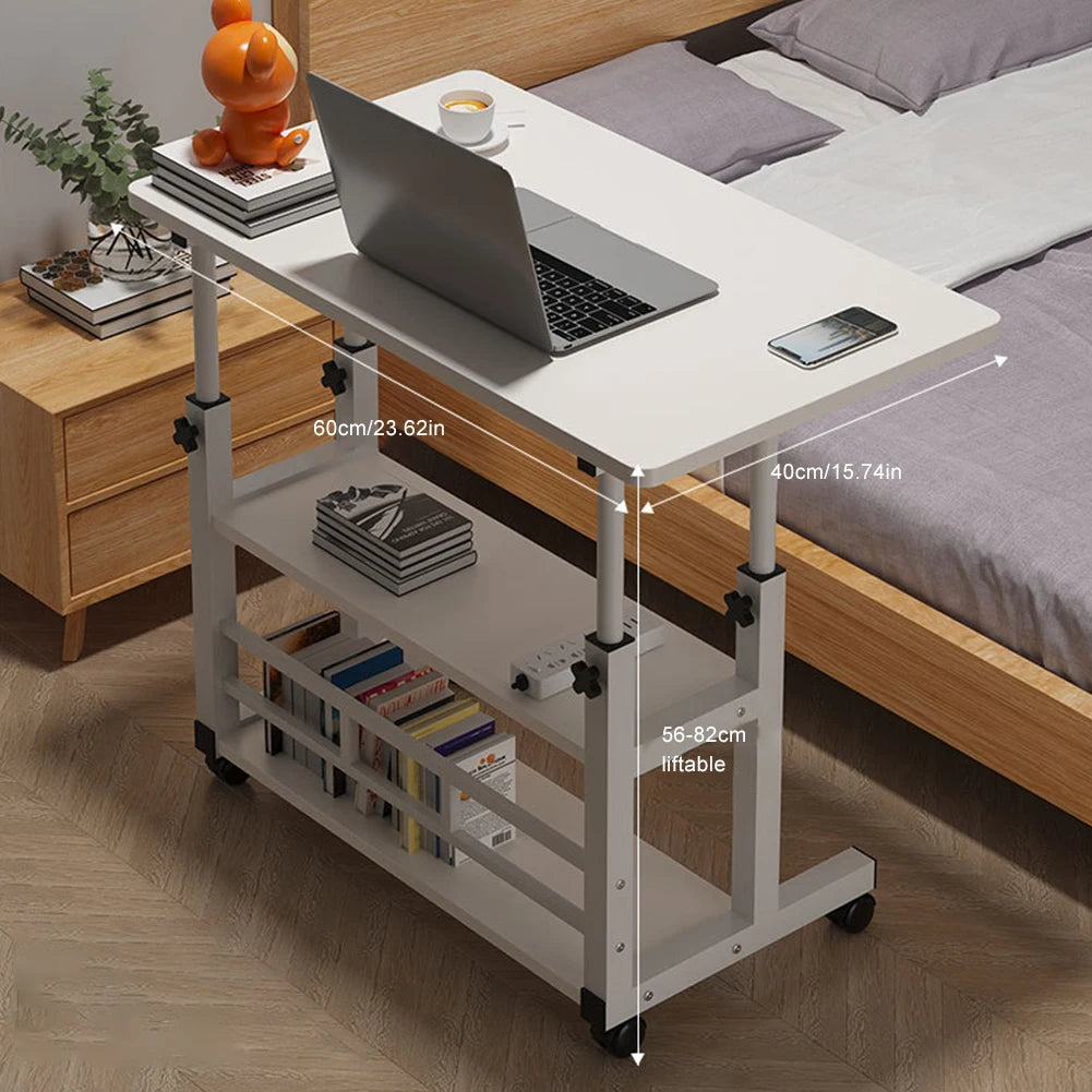 Adjustable bed side table with laptop on top, next to a bed and nightstand.