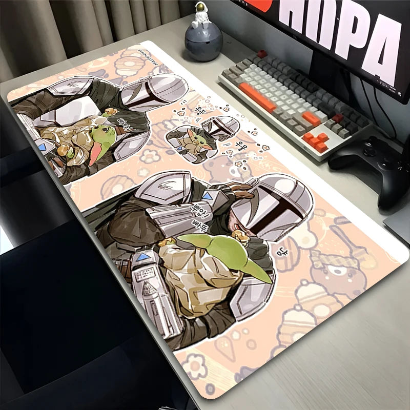 Desk setup with a large decorative mat featuring cartoon characters, keyboard, and monitor.