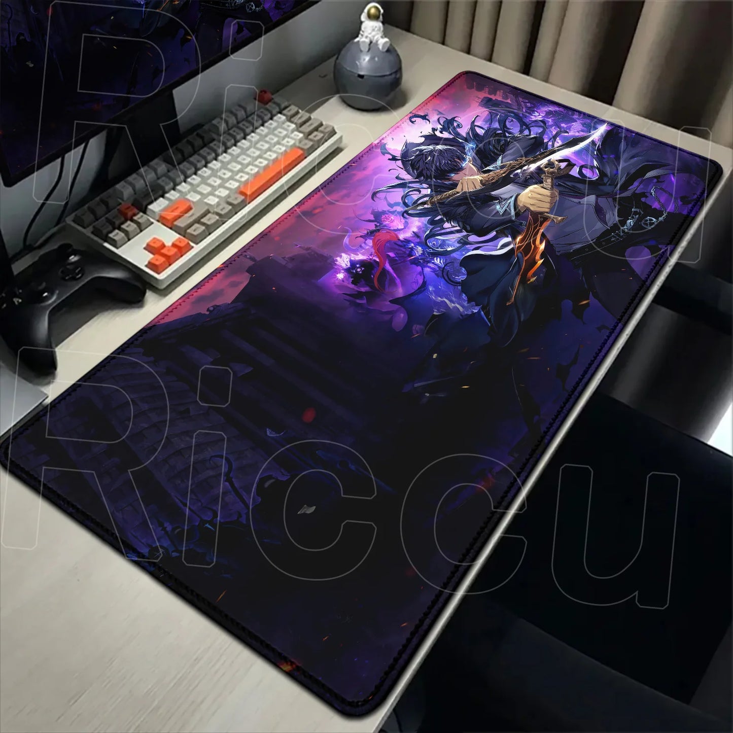 Large mouse pad with fantasy design on a desk with computer equipment.