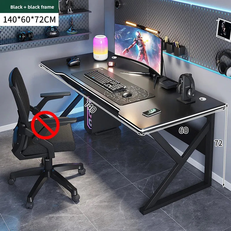 Gaming desk with chair setup in a room with gaming equipment.