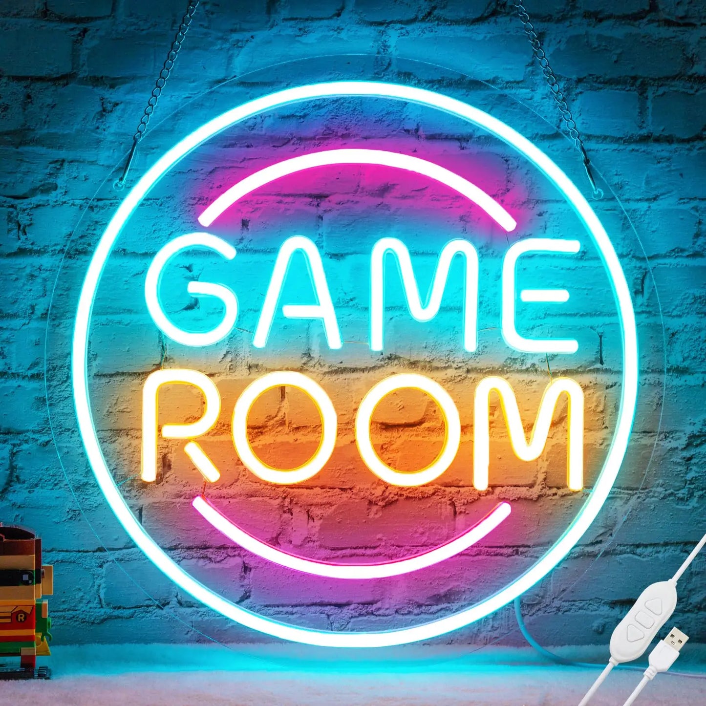 Neon sign with 'GAME ROOM' text on a brick wall background