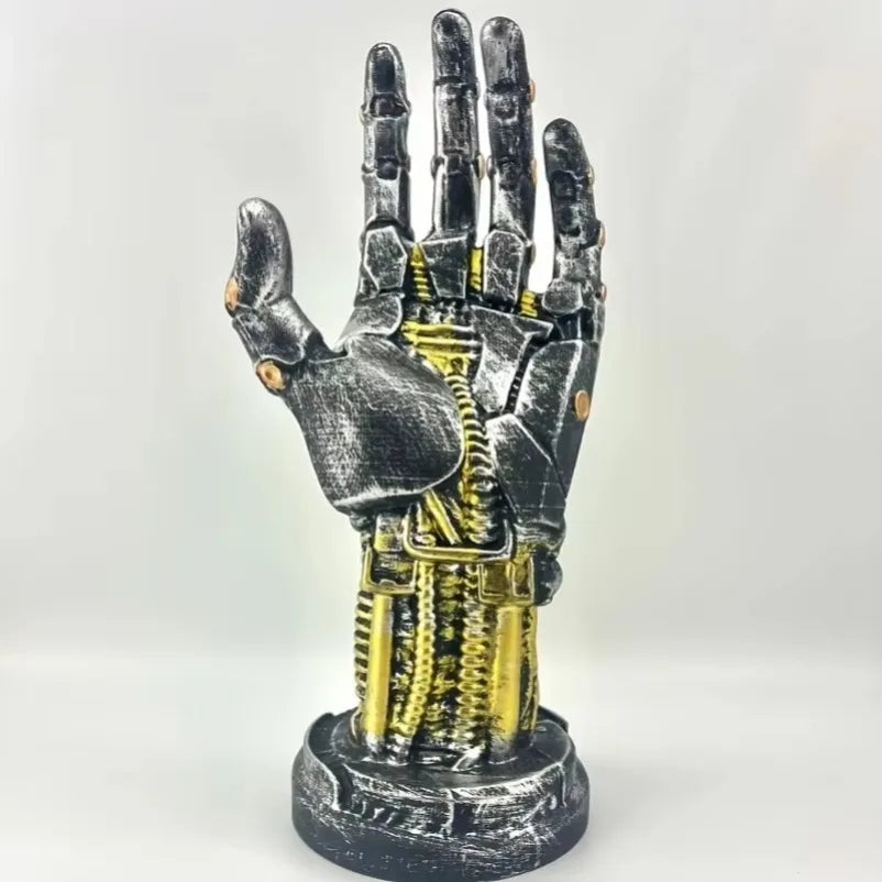 Mechanical hand sculpture with intricate details on a white background