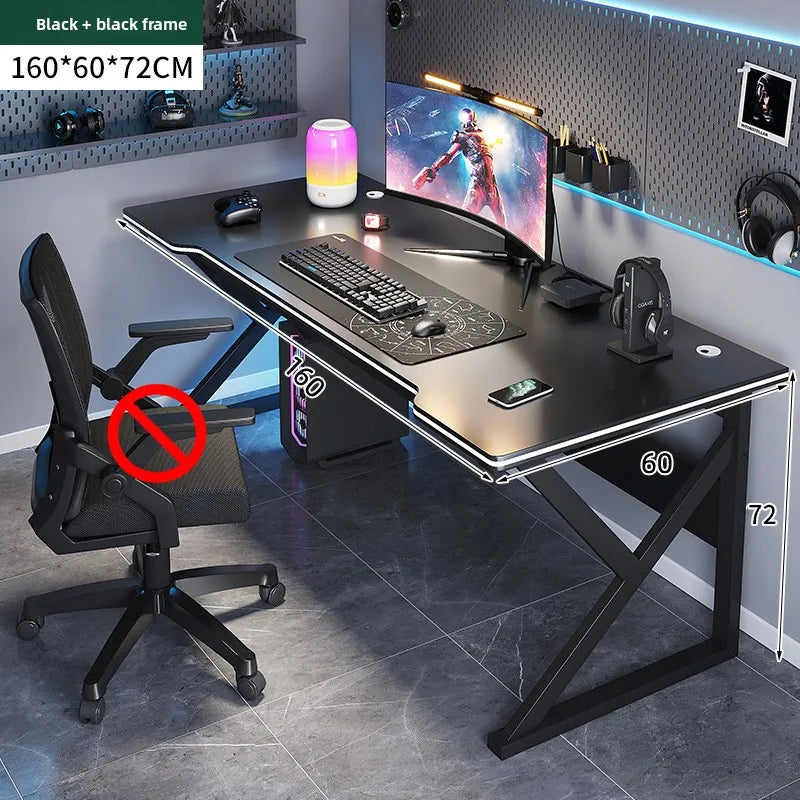 Gaming desk setup with chair, monitor, and accessories in a room.