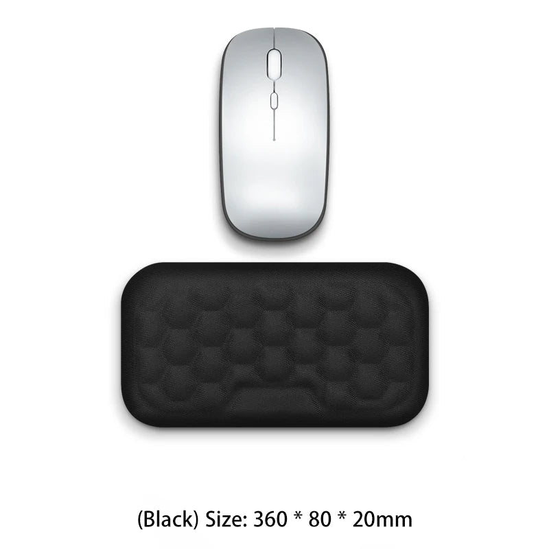 Silver computer mouse and black mouse pad on a white background