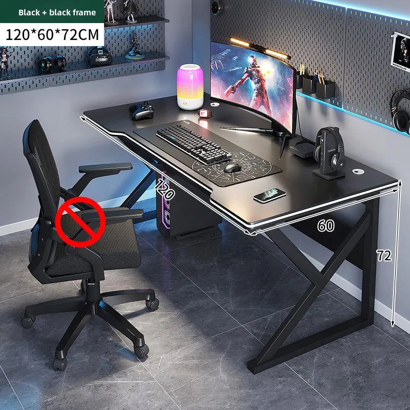 Gaming desk with chair, monitor, and accessories in a room setting.
