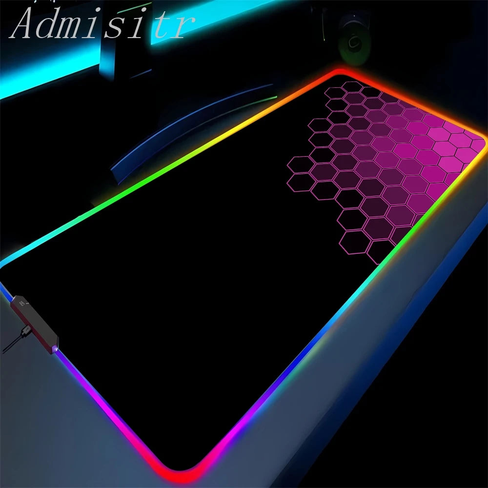 Gaming mouse pad with RGB lighting and honeycomb pattern on a dark background