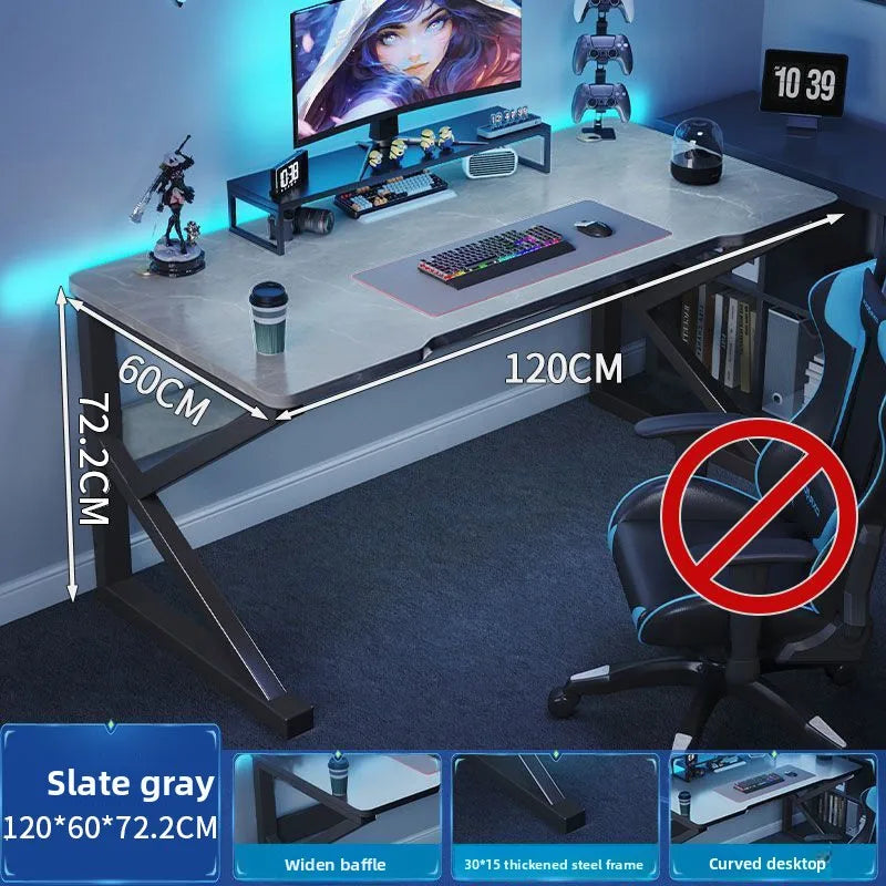 Gaming desk with dimensions labeled, featuring a computer setup and gaming chair.