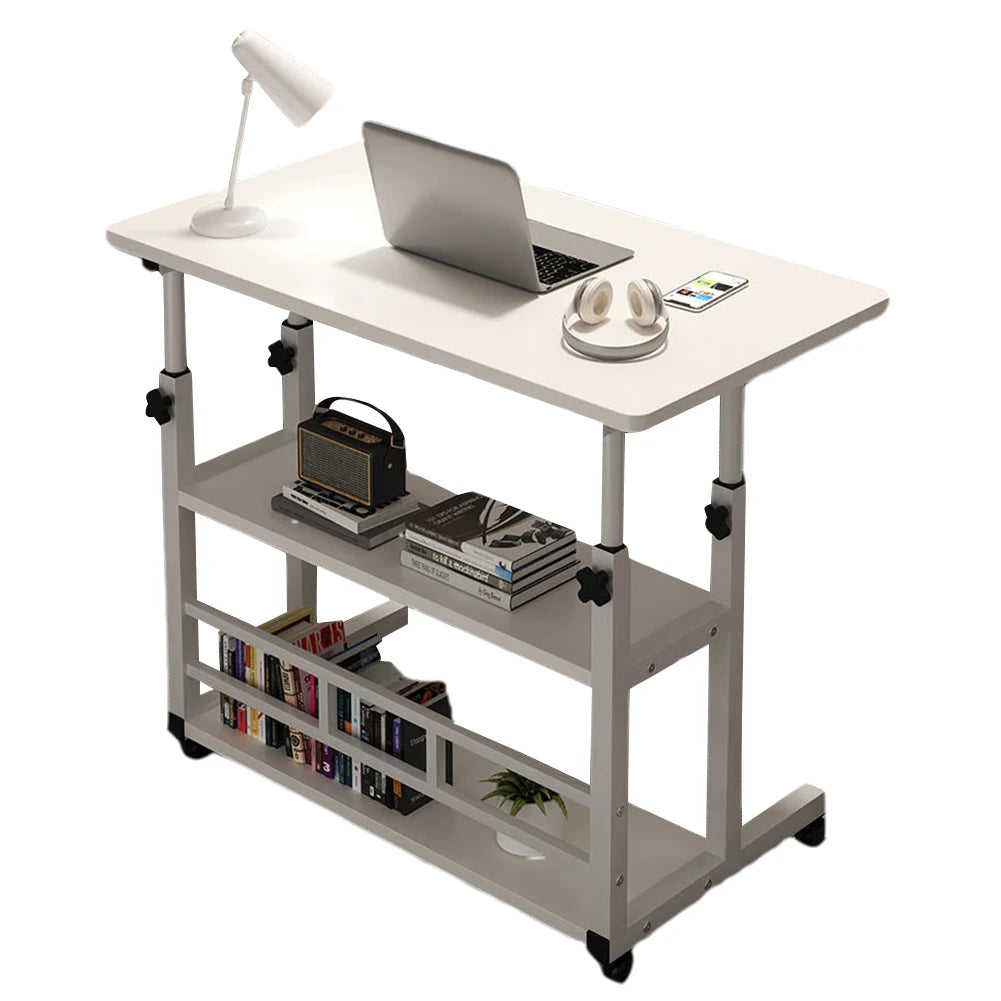 White desk with laptop, lamp, and books on a white background