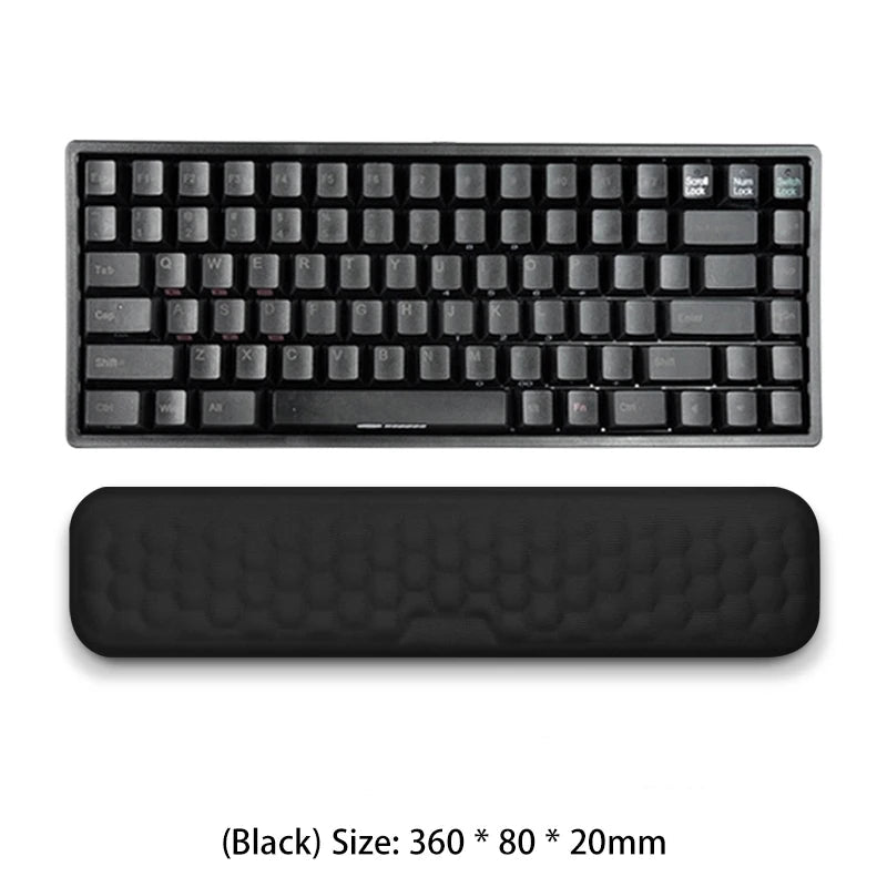 Black keyboard and wrist rest on a white background