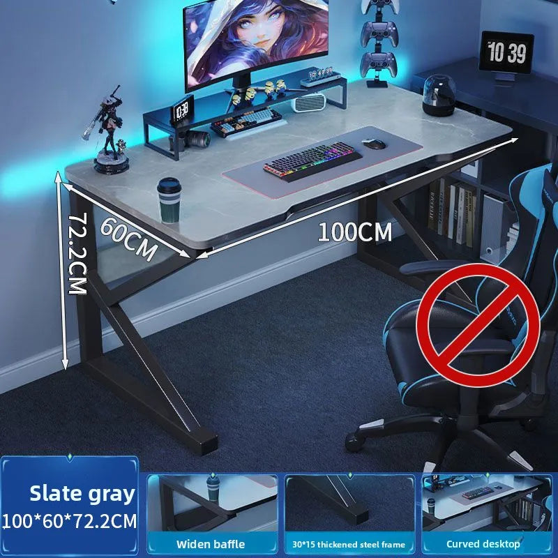 Gaming desk setup with dimensions labeled, featuring a monitor, keyboard, and chair.