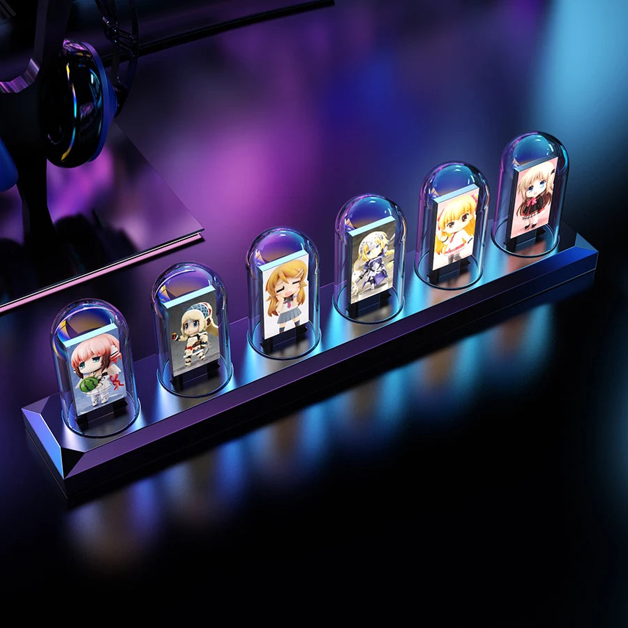 Row of small figurines in glass cases on a dark surface with purple lighting