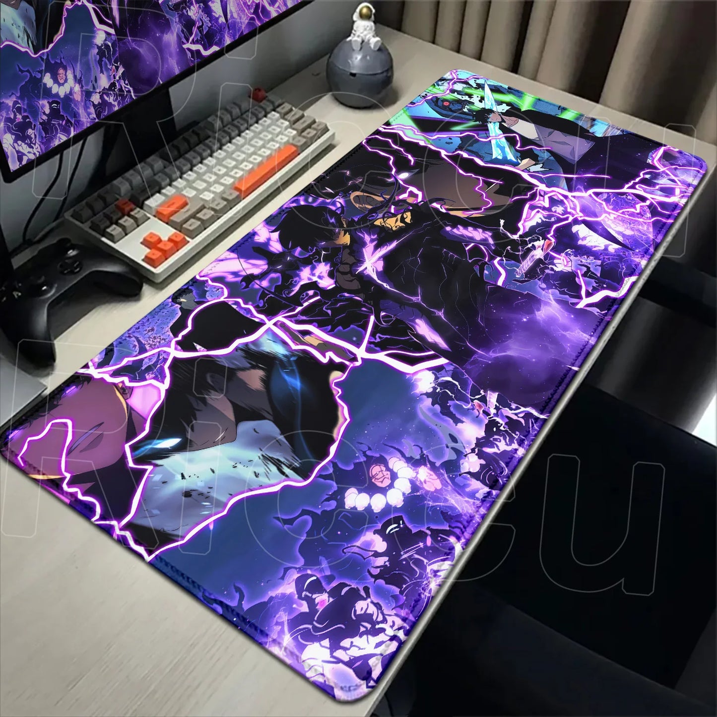 Desk setup with a large purple and black abstract design mouse pad.