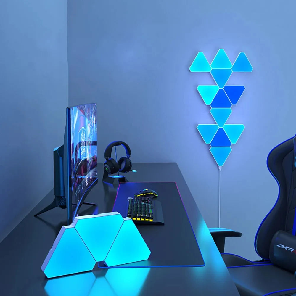 Modern gaming setup with geometric LED lights on a desk.