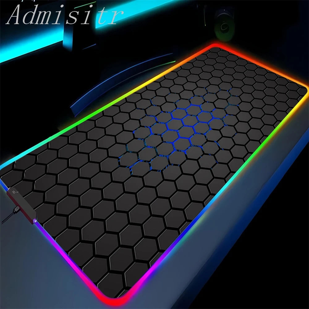 Gaming mouse pad with hexagonal pattern and colorful LED lighting on a dark background.