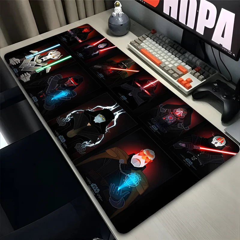 Gaming desk setup with a large mouse pad featuring character designs, keyboard, and monitor.