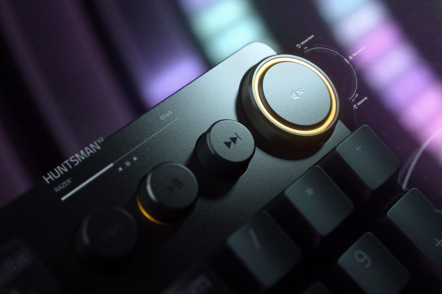 Close-up of a Huntsman gaming keyboard with control panel and illuminated keys.