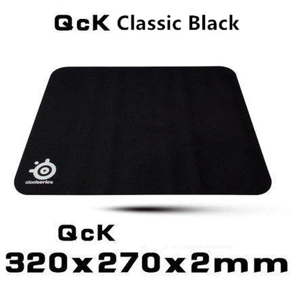 Black gaming mouse pad with QcK logo on a white background