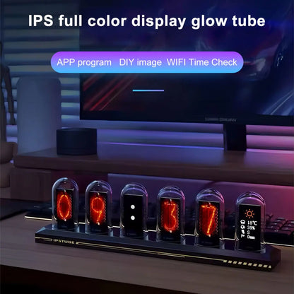 Glow tube display with digital clock and weather station on a desk, with a computer monitor in the background.