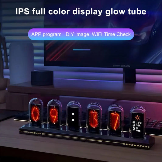 Glow tube display with digital clock and weather station on a desk, with a computer monitor in the background.