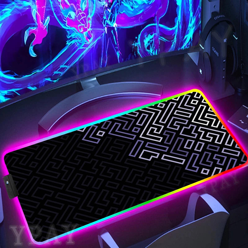 Gaming setup with a large mouse pad featuring a maze pattern and colorful LED lighting.