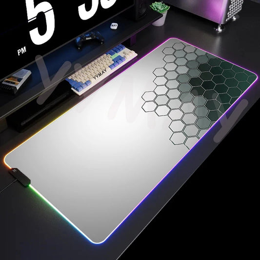 Large gaming mouse pad with hexagonal pattern on a desk setup