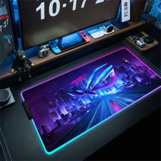 Gaming desk setup with a large mouse pad featuring a cityscape design.