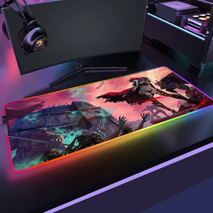 Gaming mouse pad with colorful design in front of a computer setup
