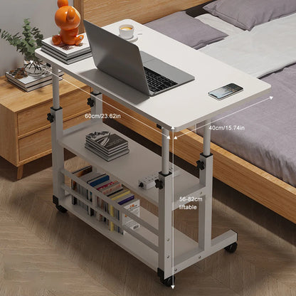 Adjustable bed side table with laptop on top, next to a bed and nightstand.
