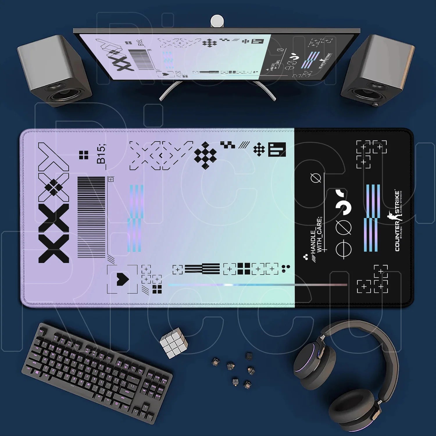Gaming setup with monitor, keyboard, mouse, and headphones on a blue surface