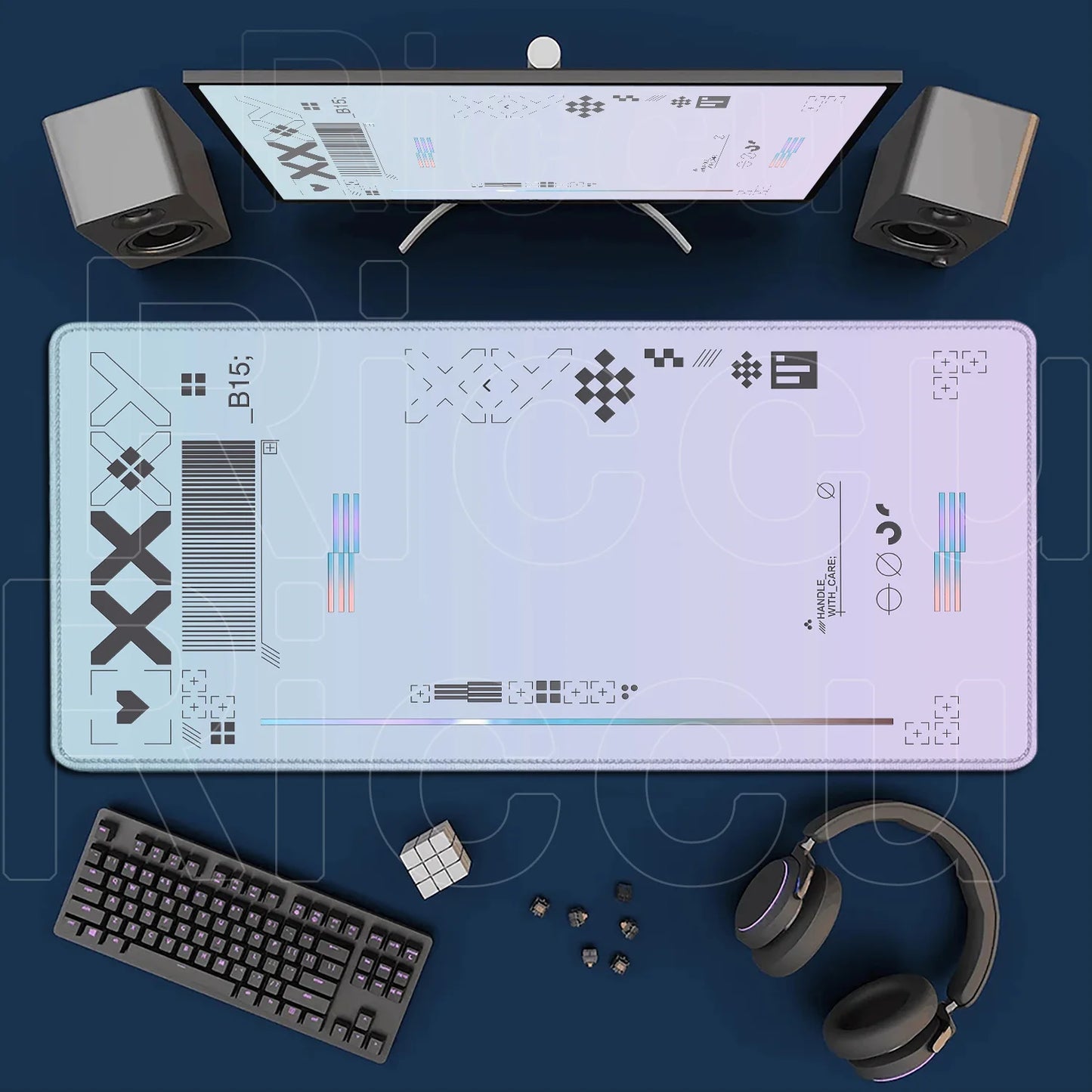Desk setup with computer monitor, keyboard, mouse, and headphones on a dark blue surface.
