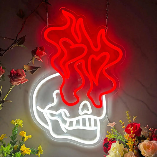 Neon sign of a skull with red flames surrounded by flowers