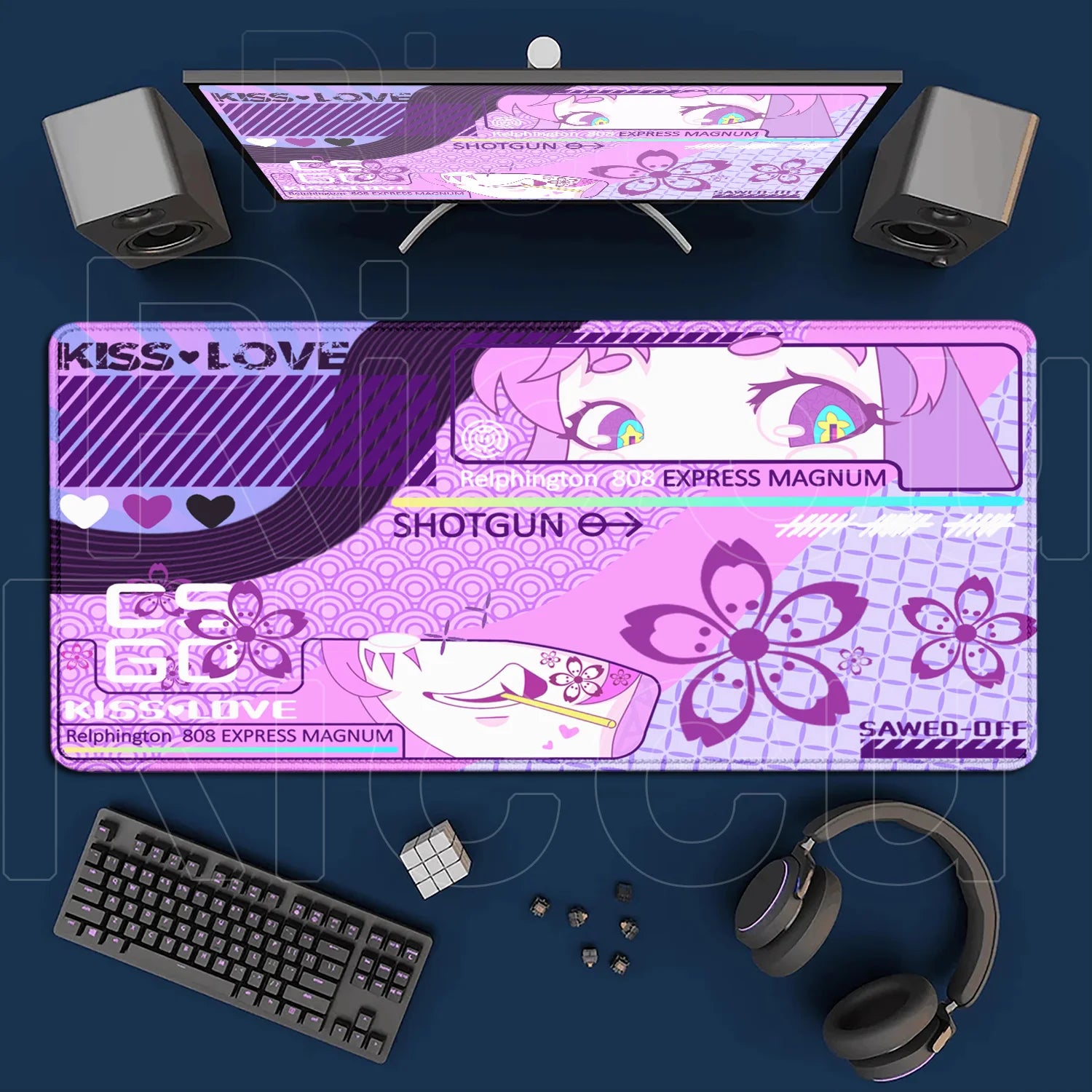 Purple gaming desk setup with monitor, keyboard, mouse, and headphones on a dark blue background