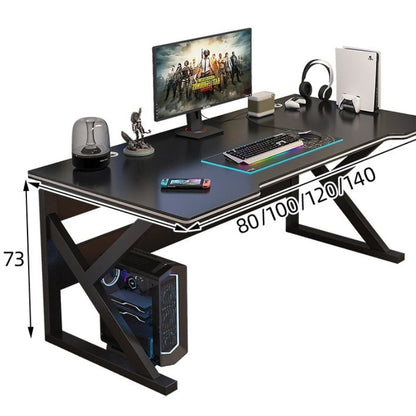 Gaming desk with computer setup, including monitor, keyboard, and speakers, on a white background.