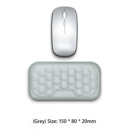 Gray computer mouse and mouse pad on a white background with text indicating 'New Upgrade - One Hand'.