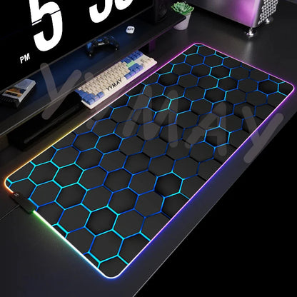 Hexagonal patterned mouse pad with RGB lighting on a desk setup