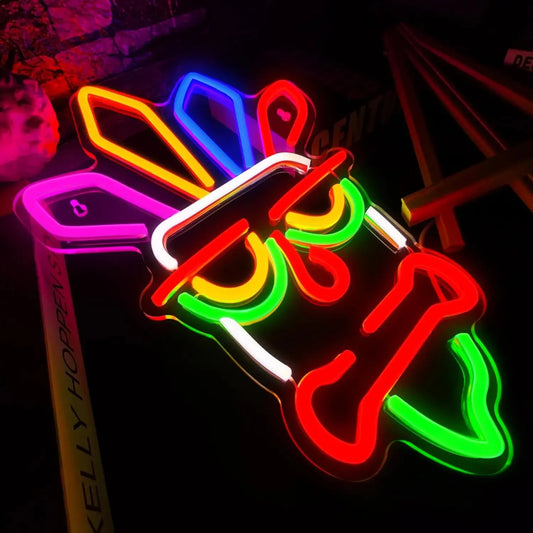 Neon sign shaped like a Texas state with colorful lights on a dark background