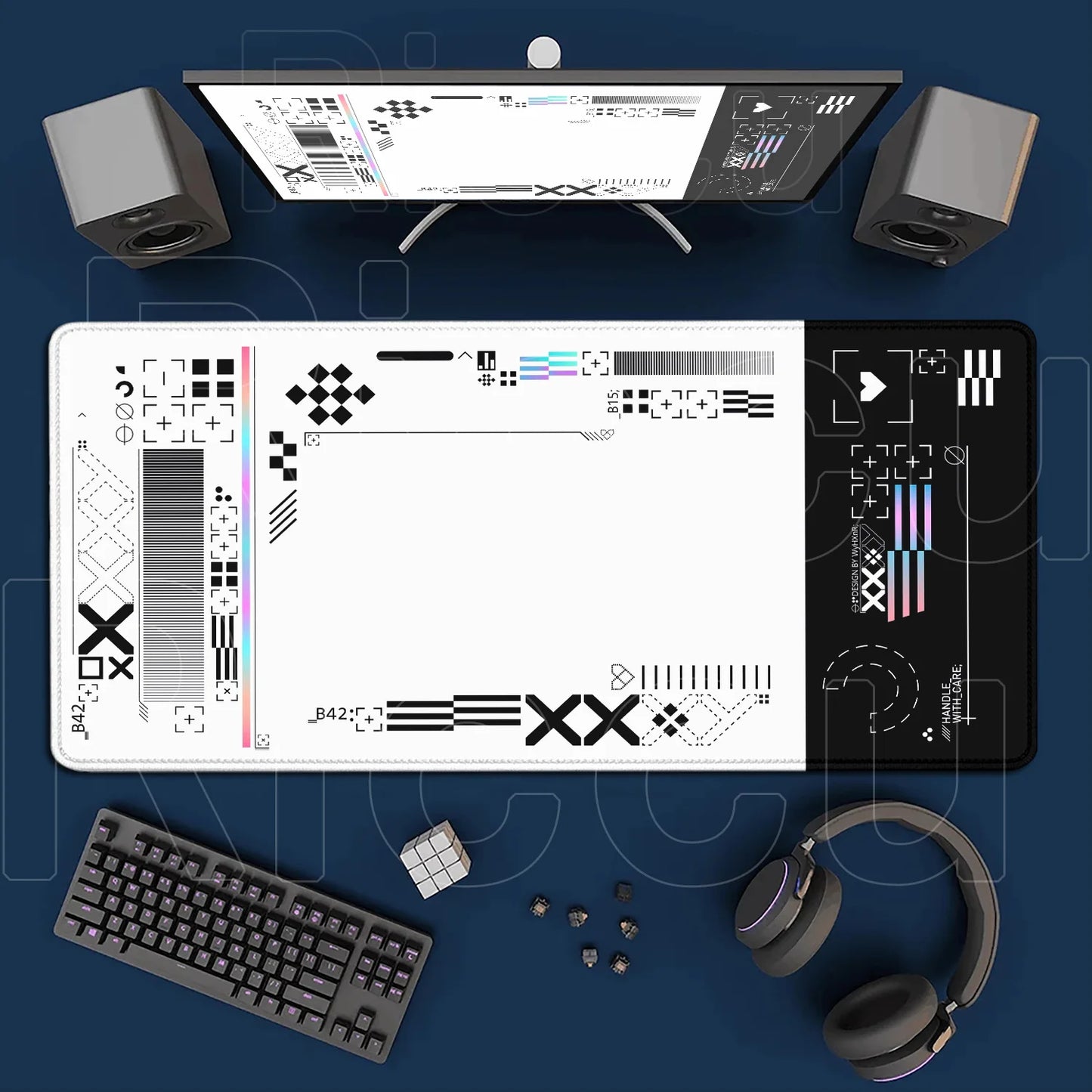Computer setup with monitor, keyboard, mouse, headphones, and desk mat on a blue background