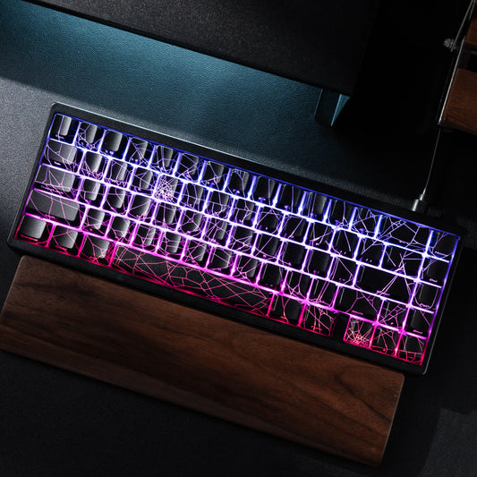 Glowing keyboard with colorful backlight on a dark surface