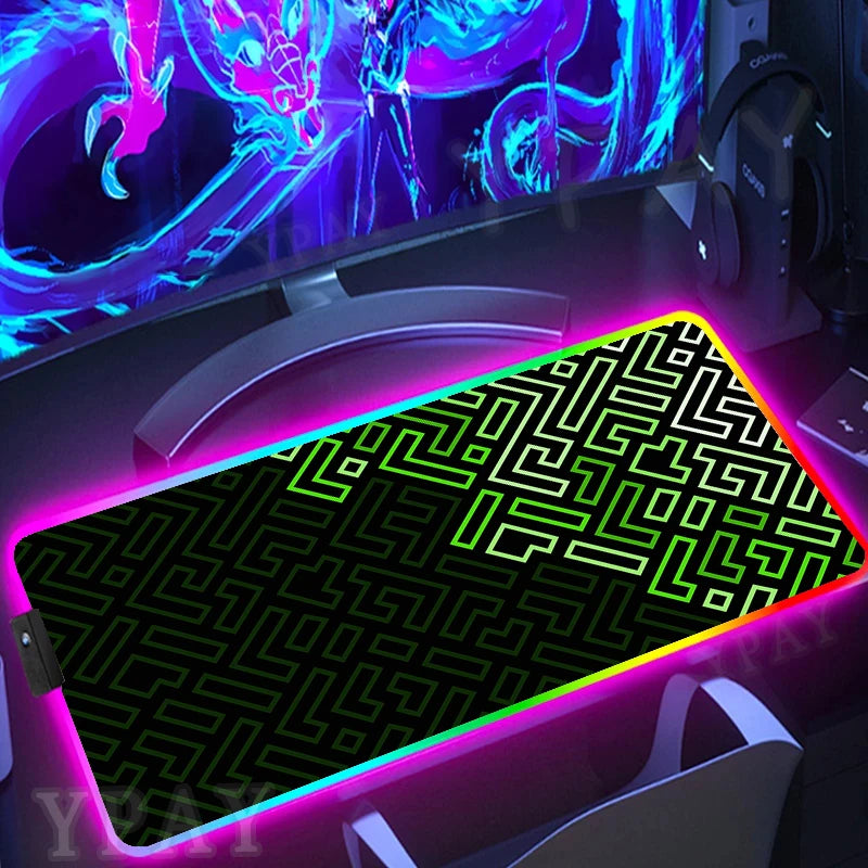 Gaming setup with a large mouse pad featuring a maze pattern and colorful lighting.