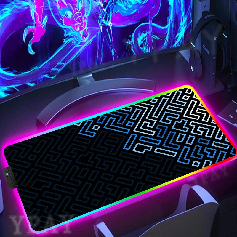 Gaming setup with a large mouse pad featuring a maze pattern and colorful lighting.
