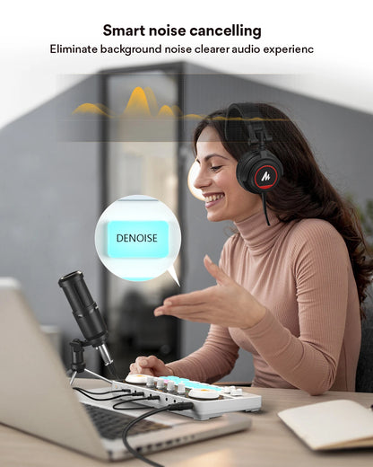 Woman wearing headphones with smart noise-cancelling feature in a home office setting.