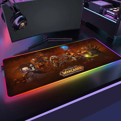 Gaming mouse pad with World of Warcraft design in front of a computer setup.