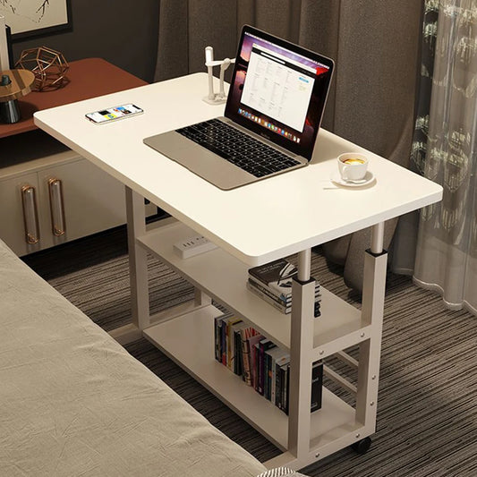 White desk with a laptop, smartphone, and cup of coffee in a bedroom setting.