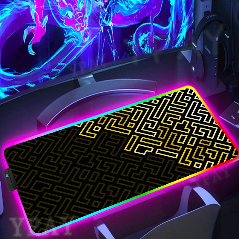 Gaming setup with a large mouse pad featuring a maze pattern and colorful lighting.