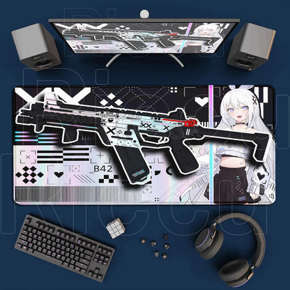 Gaming desk setup with a large mouse pad featuring a gun design, keyboard, headphones, and speakers on a blue surface.