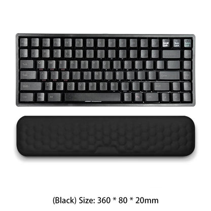 Black keyboard and wrist rest on a white background